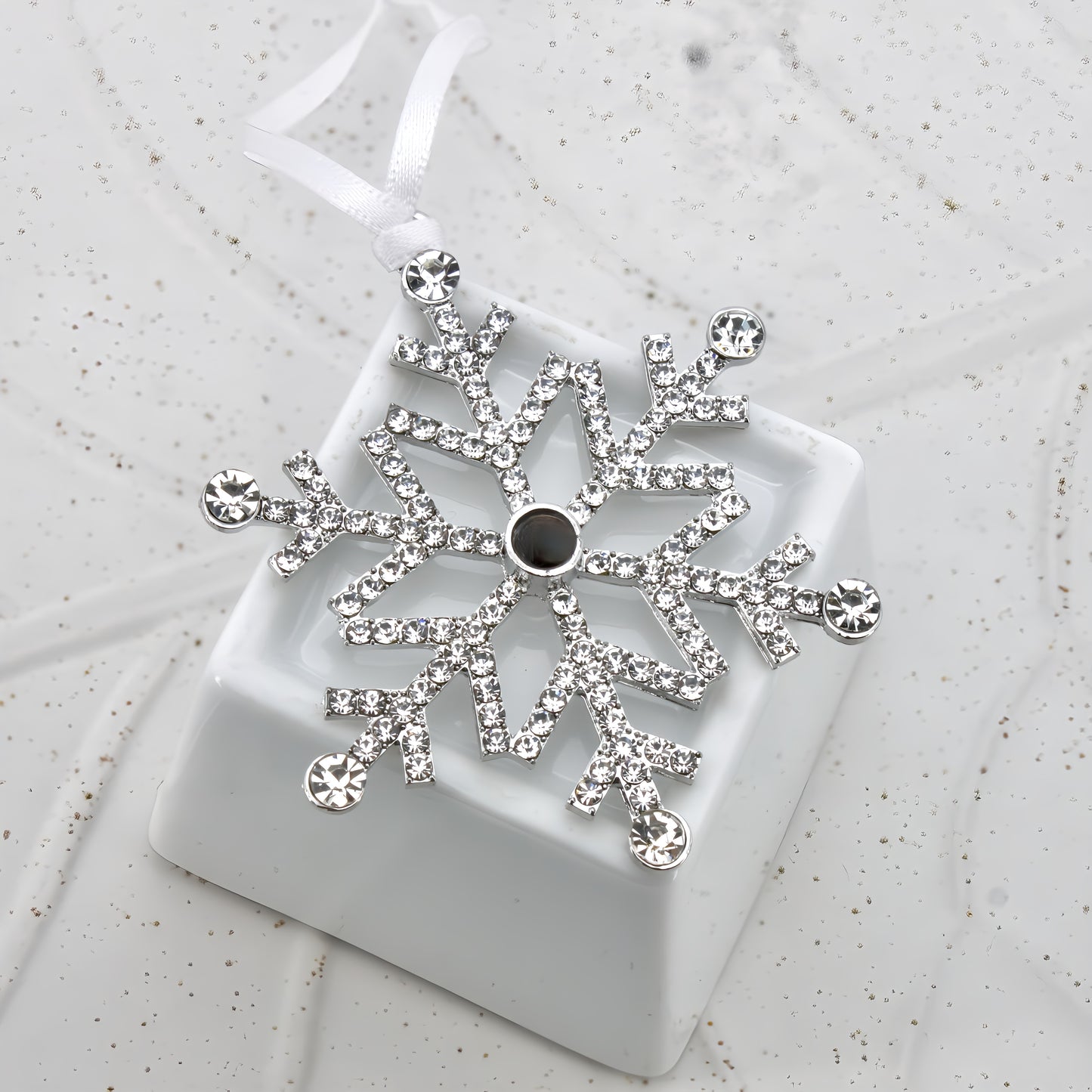adorno navideño con proyección de copos de nieve
