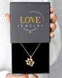 Special Paw Projection Necklace in gold, presented in a Love Jewelry gift box