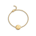 Gold Always With You Locket Bracelet on a speckled ceramic plate with adjustable chain visible
