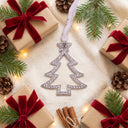 Christmas Tree Projection Ornament in a festive Christmas flat lay