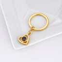 Heart Projection Keychain in gold on a jewellery tray