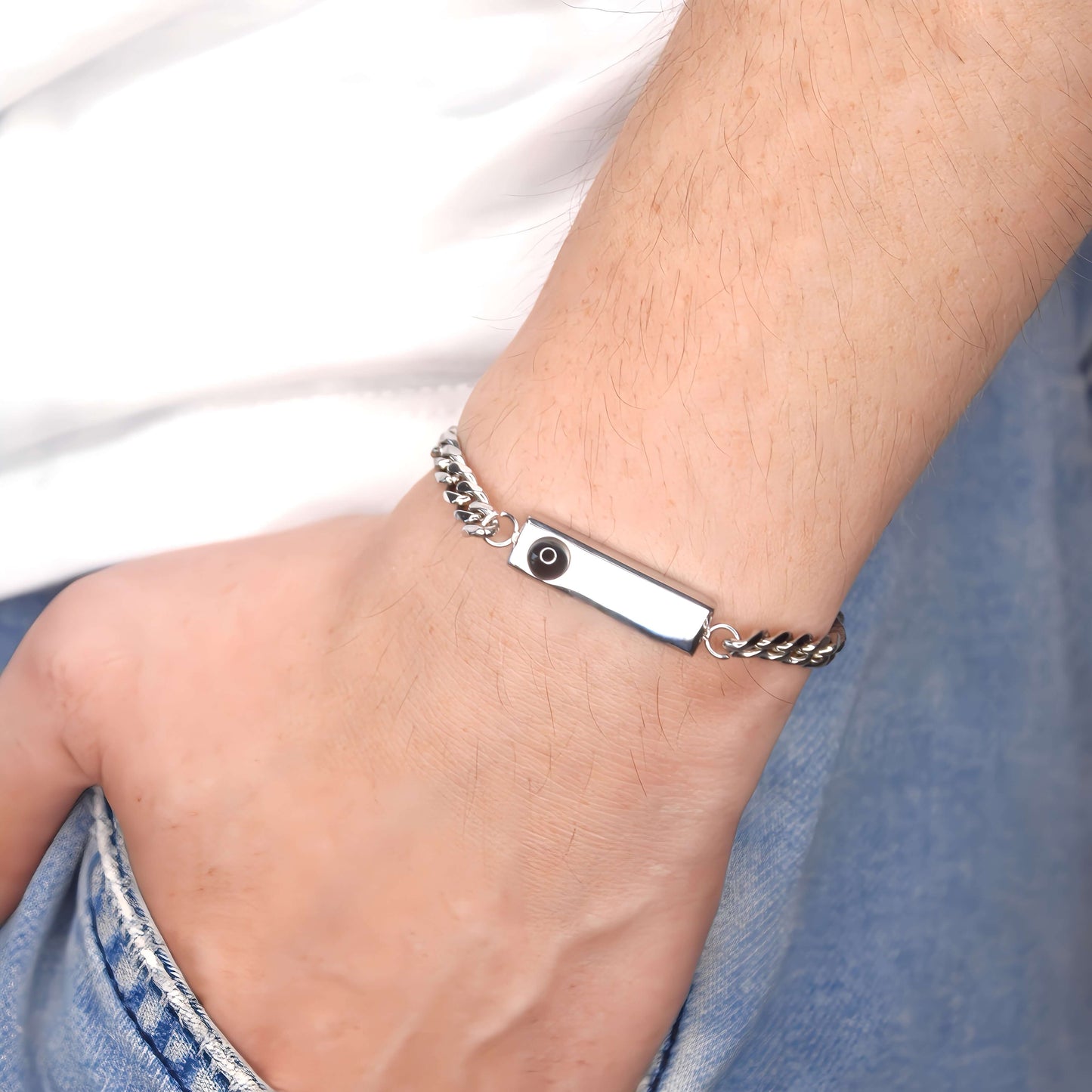 close-up of cuban engraved projection bracelet on wrist, customizable photo bracelet, perfect memorial gift, unique projection jewellery