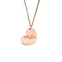 Rose gold heart-shaped pendant necklace with 'Love you Mummy' engraving on a light gray background