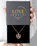 Compass Heart Projection Necklace in rose gold, presented in a Love Jewelry gift box