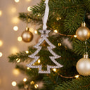 Christmas Tree Projection Ornament hanging on a Christmas tree