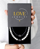 Matching Beads Projection Bracelet in black, presented in a Love Jewelry gift box