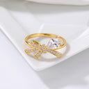 Tiny Bow Tie Ring in gold on a jewellery tray