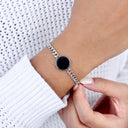 Magic Heat Bracelet in silver, worn by a woman