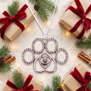 Delicate Paw Projection Christmas Ornament in a festive Christmas flat lay