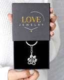 Paw Print Memorial Projection Keychain in silver, presented in a Love Jewelry gift box