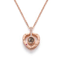 Compass Heart Projection Necklace in rose gold, on a white background