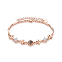 Lucky Clover Projection Bracelet in rose gold on a white background
