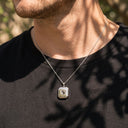 Square Pendant Projection Necklace in silver, worn by a man