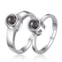 Minimalist Couple Projection Ring in silver on a white background