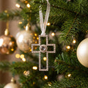 Forever Cross Projection Christmas Ornament hanging on a Christmas tree