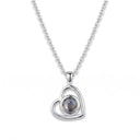 Small Heart Projection Necklace in silver on a white background