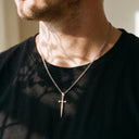 Sword pendant from the Heart & Sword Couple's Necklace in silver, worn by a man
