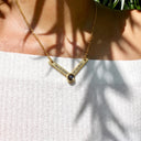Engraved V-Style Projection Necklace in gold, worn by a model