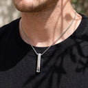 Pillar Projection Necklace in silver, worn by a man