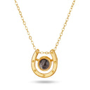 Horseshoe Lucky Charm Projection Necklace in gold on a white background
