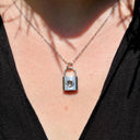 Padlock Pendant Projection Necklace in silver, worn by a model