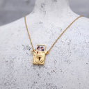 Camera Custom Photo Locket in gold, on a jewellery bust
