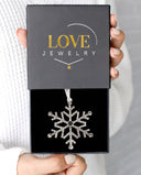 Snowflake Projection Christmas Ornament in silver, presented in a Love Jewelry gift box