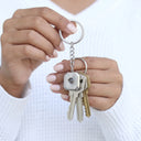 Square Projection Keychain with keys, held in hand