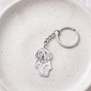 Silhouette Pet Photo Engraved Keychain in silver on a ceramic plate