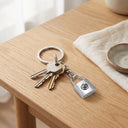 Padlock Projection Keychain with keys on a table