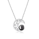Midnight Moon Projection Necklace in silver on a white background