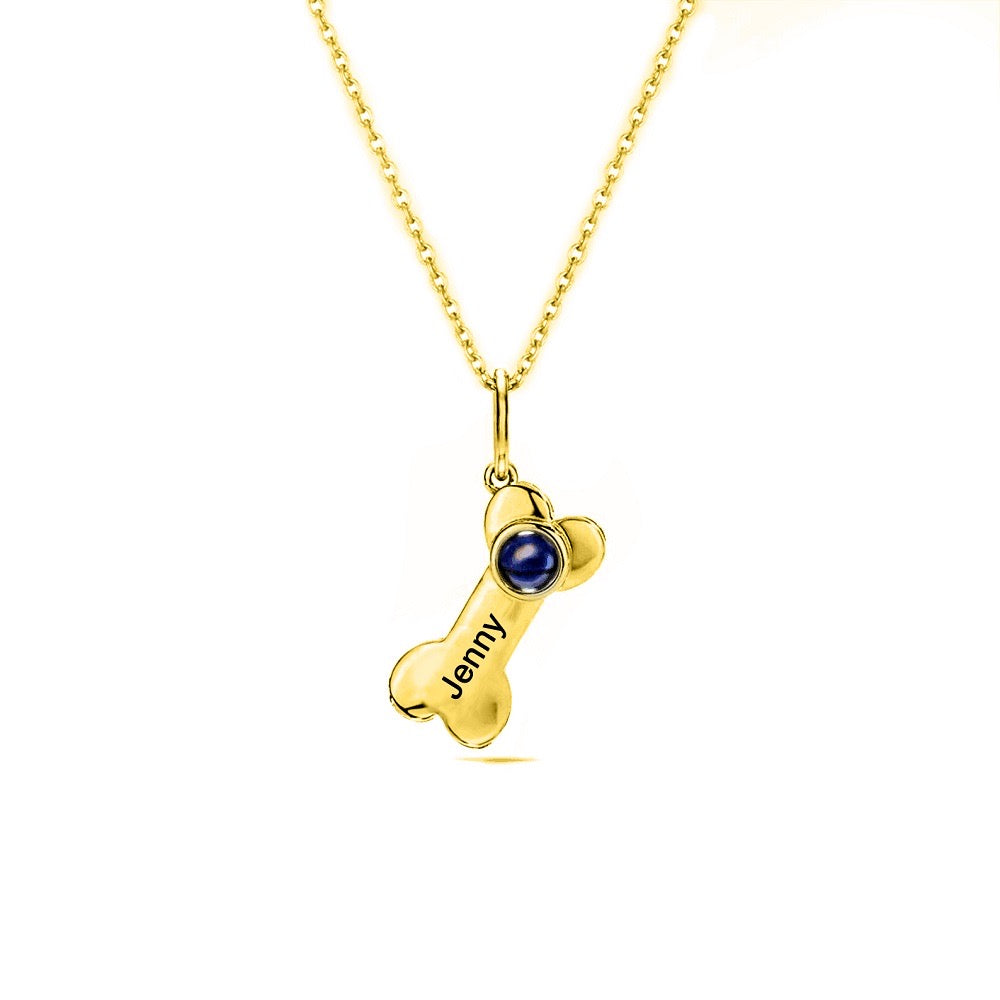 "pet lover's necklace: a charming necklace with a dog bone charm, perfect for animal enthusiasts."