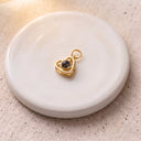 Love You Forever Projection Charm in gold on a round dish