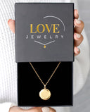 Round Photo Locket in gold, presented in a Love Jewelry gift box