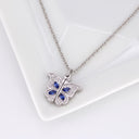 Butterfly Custom Photo Locket in silver, on a jewellery tray