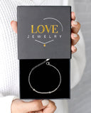 Morse Code Bracelet in silver, displayed in a Love Jewelry gift box