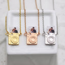 Camera Custom Photo Locket in silver, gold and rose gold, on a marble cube