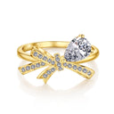 Tiny Bow Tie Ring in gold on a white background
