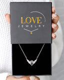 Pure Angel Wings Projection Necklace in silver, presented in a Love Jewelry gift box