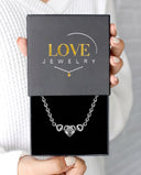 Diamond Heart Pendant Projection Bracelet in silver, presented in a Love Jewelry gift box
