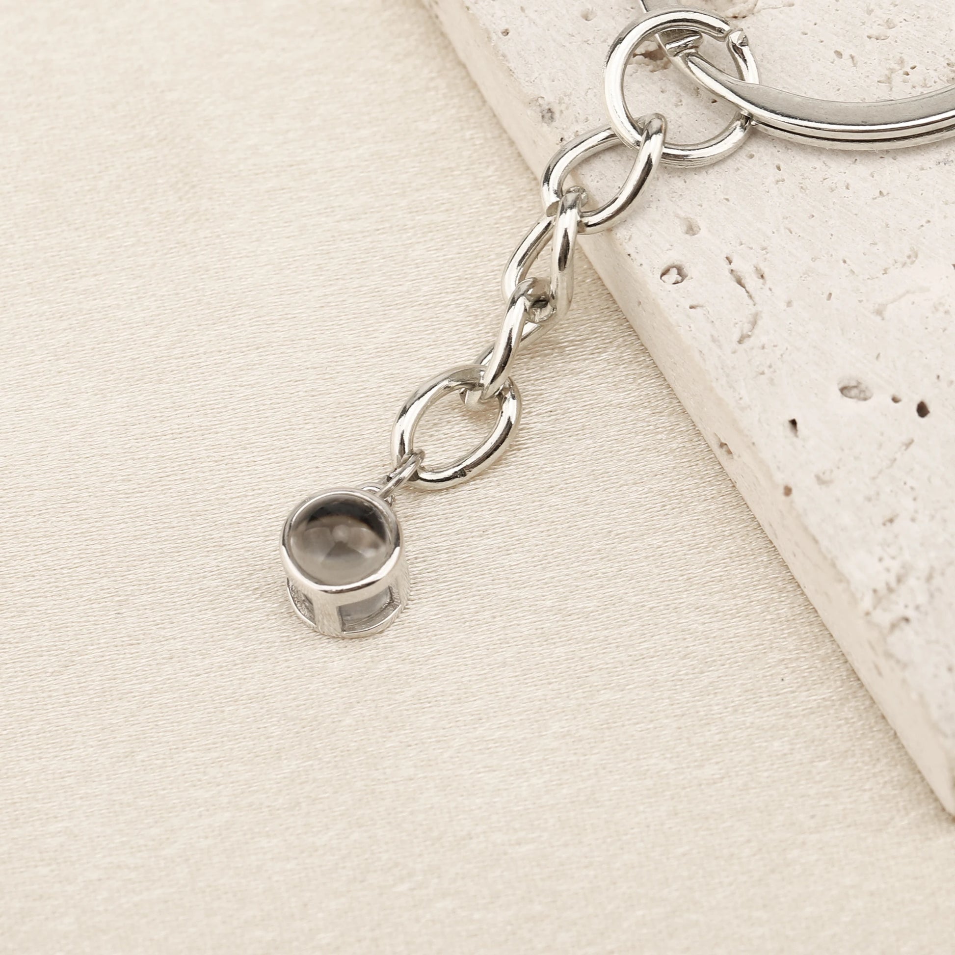 "Embrace Memories with Minimalist Projection Keychain"