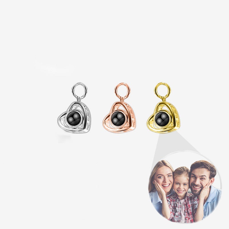 "cherished memories projection charm: a charm designed to project cherished memories, adding sentimental value to any accessory."